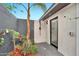 A private outdoor shower area with sleek black fixtures and lush landscaping at 1955 E Greenway Rd, Phoenix, AZ 85022