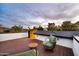 Rooftop deck features comfortable seating and scenic views during a pastel-colored twilight at 1955 E Greenway Rd, Phoenix, AZ 85022