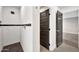 Contemporary shower with sleek black accent line, dark tile flooring, and modern fixtures at 1955 E Greenway Rd, Phoenix, AZ 85022