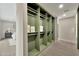 Spacious walk-in closet with custom shelving and ample storage space at 1955 E Greenway Rd, Phoenix, AZ 85022
