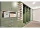 Organized walk-in closet features custom cabinets and shelving at 1955 E Greenway Rd, Phoenix, AZ 85022