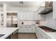 Modern kitchen featuring white cabinets, stainless steel appliances, and a sleek, minimalist design at 20378 N 96Th Way, Scottsdale, AZ 85255