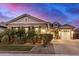 Charming home featuring manicured landscaping and an inviting front entrance at 20552 E Reins Rd, Queen Creek, AZ 85142