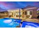 Backyard featuring a sparkling pool, covered patio with outdoor seating, perfect for entertaining at 20552 E Reins Rd, Queen Creek, AZ 85142