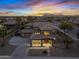 Stunning aerial view of two-story home with desert landscaping and mountain views at sunset at 21503 E Alyssa Ct, Queen Creek, AZ 85142