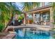Inviting outdoor living space features a sparkling pool, covered patio and lush landscaping at 21503 E Alyssa Ct, Queen Creek, AZ 85142