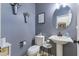 Stylish powder room featuring a pedestal sink and decorative accents at 21503 E Alyssa Ct, Queen Creek, AZ 85142
