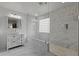 Bright bathroom with a stand alone vanity, glass shower, and classic design elements at 21503 E Alyssa Ct, Queen Creek, AZ 85142