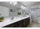 Bathroom features dual sinks, dark wood cabinets, and a separate tub and shower at 21503 E Alyssa Ct, Queen Creek, AZ 85142