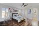Bright bedroom with wood floors features ceiling fan, natural light and inviting decor at 21503 E Alyssa Ct, Queen Creek, AZ 85142