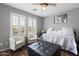 Bedroom featuring a window seat, two lounge chairs and plenty of light with wood laminate floors at 21503 E Alyssa Ct, Queen Creek, AZ 85142