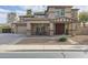 Charming front of two-story home with covered porch and a three car garage at 21503 E Alyssa Ct, Queen Creek, AZ 85142