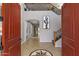 Grand two-story foyer with tile flooring, staircase, and arched doorway at 21503 E Alyssa Ct, Queen Creek, AZ 85142