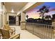 Relaxing front porch with chairs and a view of the neighborhood sunset at 21503 E Alyssa Ct, Queen Creek, AZ 85142