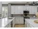 Stylish kitchen with quartz countertops, modern appliances, and ample counter space, perfect for cooking and entertaining at 21503 E Alyssa Ct, Queen Creek, AZ 85142