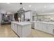 Elegant kitchen features a large island, stainless steel appliances, and easy access to the living area at 21503 E Alyssa Ct, Queen Creek, AZ 85142