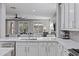Well-appointed kitchen boasts modern fixtures, quartz countertops, and seamless flow into the living space at 21503 E Alyssa Ct, Queen Creek, AZ 85142
