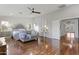 Spacious main bedroom boasting ample natural light, hard wood floors, and a comfortable sitting area at 21503 E Alyssa Ct, Queen Creek, AZ 85142