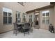 Inviting patio with stylish outdoor dining set and neutral tones creates a relaxing entertainment space at 21503 E Alyssa Ct, Queen Creek, AZ 85142