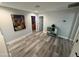 A stylish hallway showcasing contemporary design elements and hardwood flooring at 22803 S 215 St, Queen Creek, AZ 85142