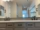 Elegant bathroom with double sinks, quartz countertops, and modern fixtures at 23139 E Canary Way, Queen Creek, AZ 85142