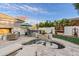 Backyard with a water feature, outdoor bar, and seating area, great for relaxing and entertaining at 2643 E Tamarisk St, Gilbert, AZ 85296