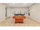 Spacious basement with pool table, plantation shutters, and neutral color palette at 2643 E Tamarisk St, Gilbert, AZ 85296