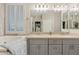 Bright bathroom with double sinks, soaking tub, and plantation shutters at 2643 E Tamarisk St, Gilbert, AZ 85296