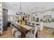 Open-concept dining area with modern chandelier and a view of the kitchen and living space at 2643 E Tamarisk St, Gilbert, AZ 85296