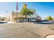 Exterior view of the office building with traditional architecture, an American flag, and ample parking space at 2643 E Tamarisk St, Gilbert, AZ 85296