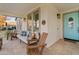 Inviting front porch features comfortable seating and a stylish blue door, perfect for relaxing and greeting guests at 2643 E Tamarisk St, Gilbert, AZ 85296