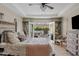 Comfortable main bedroom leading to an outdoor seating area through double doors at 2643 E Tamarisk St, Gilbert, AZ 85296