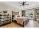 Spacious main bedroom with tray ceiling, ceiling fan, and access to the backyard at 2643 E Tamarisk St, Gilbert, AZ 85296