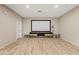 Home theater with large screen, ample space, and storage baskets to keep things organized at 2643 E Tamarisk St, Gilbert, AZ 85296