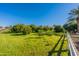 This property has a vast yard with mature trees, set behind a white fence, and is perfect for outdoor activities at 2643 E Tamarisk St, Gilbert, AZ 85296