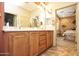 Bathroom featuring double sinks, granite counters, and a walk-in shower at 26997 W Tonopah Dr, Buckeye, AZ 85396