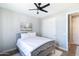Comfortable bedroom with a gray bed, ceiling fan, and sliding closet doors at 2819 N 28Th Pl, Phoenix, AZ 85008