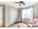 Bedroom featuring light colors, window and ceiling fan at 2819 N 28Th Pl, Phoenix, AZ 85008