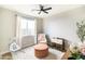 Bedroom featuring neutral tones, window and ceiling fan at 2819 N 28Th Pl, Phoenix, AZ 85008