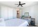 Bedroom featuring a gray bed, ceiling fan, closet, and decorative dresser with mirror at 2819 N 28Th Pl, Phoenix, AZ 85008