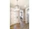 Entryway featuring wood-look floors, a modern front door, and a view into the bedroom at 2819 N 28Th Pl, Phoenix, AZ 85008