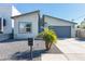 Contemporary single-story home with a gray garage door, modern mailbox, and desert landscaping at 2819 N 28Th Pl, Phoenix, AZ 85008
