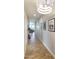 Hallway featuring wood-look tile floors and modern lighting fixture at 2819 N 28Th Pl, Phoenix, AZ 85008