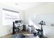Home gym featuring office space, weightlifting equipment and stationary bike at 2819 N 28Th Pl, Phoenix, AZ 85008