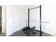 Home gym with weightlifting equipment and double doors at 2819 N 28Th Pl, Phoenix, AZ 85008