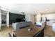 Bright, open-concept living space featuring dining area, living room with a large sectional sofa and kitchen with island at 2819 N 28Th Pl, Phoenix, AZ 85008