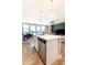 Bright, open-concept living space featuring a modern kitchen with a stainless steel dishwasher and a large island at 2819 N 28Th Pl, Phoenix, AZ 85008