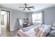 Stylish main bedroom featuring a ceiling fan, vanity, modern decor, and plenty of natural light at 2819 N 28Th Pl, Phoenix, AZ 85008