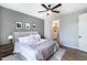 Spacious main bedroom with a modern design, featuring neutral tones, a ceiling fan, and an en-suite bathroom at 2819 N 28Th Pl, Phoenix, AZ 85008