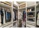 Organized walk-in closet with custom shelving, drawers, and hanging rods for optimal storage at 2819 N 28Th Pl, Phoenix, AZ 85008